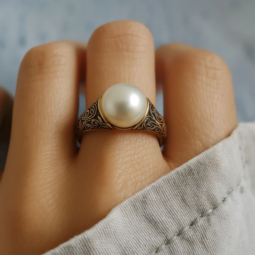Bague vintage en or ornée d'une perle
